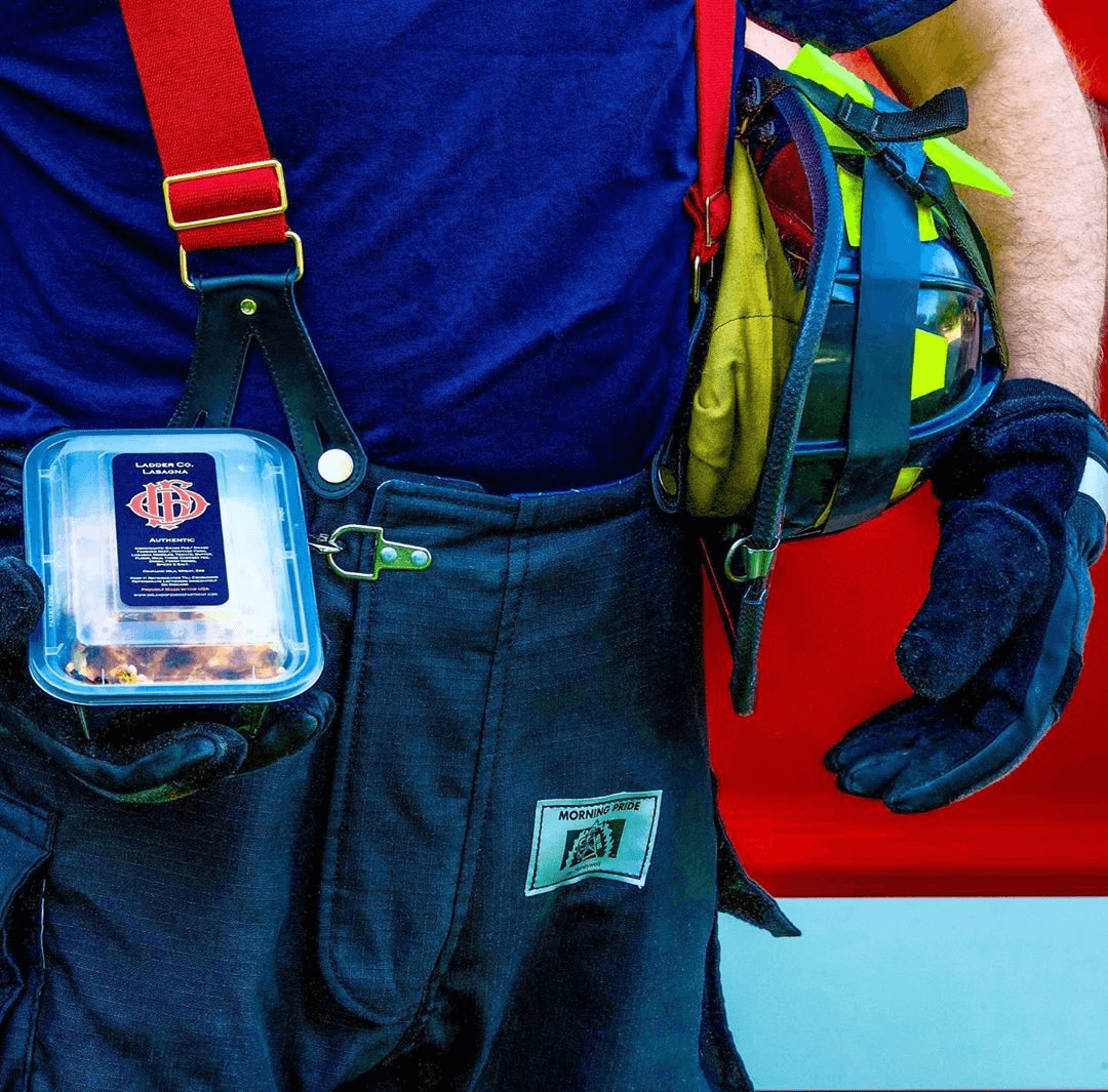 Firefighter holding Fire Dept Meals