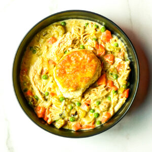 Chief's Chicken Pot Pie features creamy filling with peas, carrots, and shredded chicken, all topped with a golden biscuit.