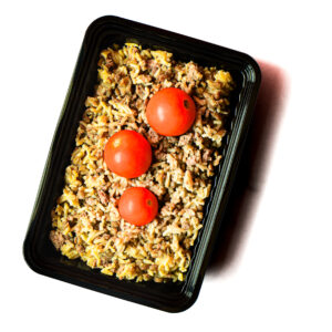 Operation Cajun Fit is a black plastic container with rice, ground meat, and three whole cherry tomatoes on top.