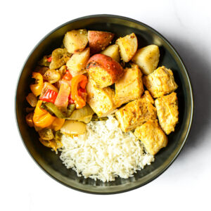 Nacho Libre Gains Bowl: white rice, roasted potatoes, seasoned chicken, sautéed bell peppers & onions.