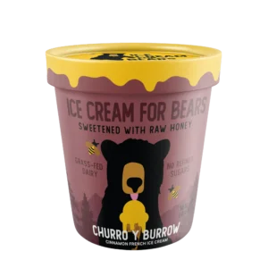 A pint of Churro y Burrow - Coming 2026 cinnamon French ice cream, with a bear graphic, raw honey, grass-fed dairy, and no refined sugars.