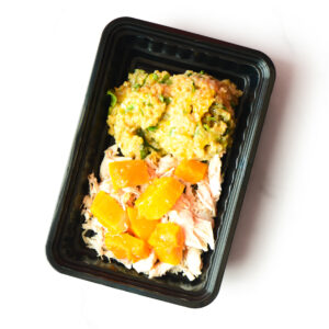 A black plastic meal tray with shredded chicken, orange cubes of squash, and a serving of mashed vegetables.