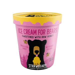 A pink container labeled "Strawbeary" features a bear, yellow lid, and notes strawberry flavor with honey and grass-fed dairy.